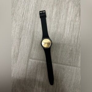 Swatch unisex black & gold watch